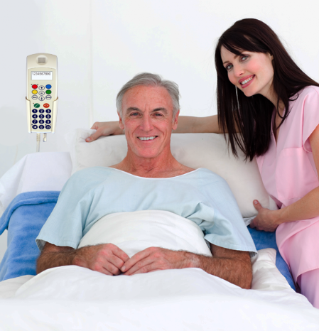 Patient in hospital bed Patient with Ergophone bedside terminal